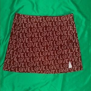 NWT Urban Outfitters Red LOVE Patterned Mini Skirt size Medium- Flaw